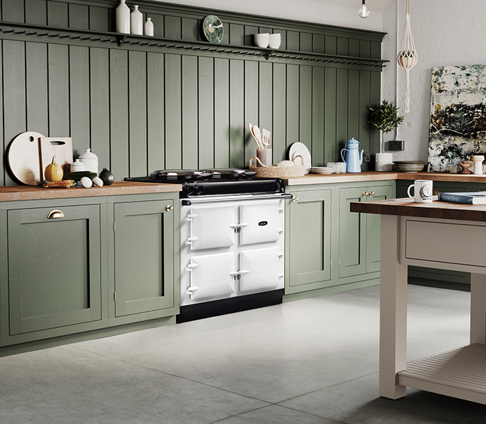 White AGA in a soft green kitchen.