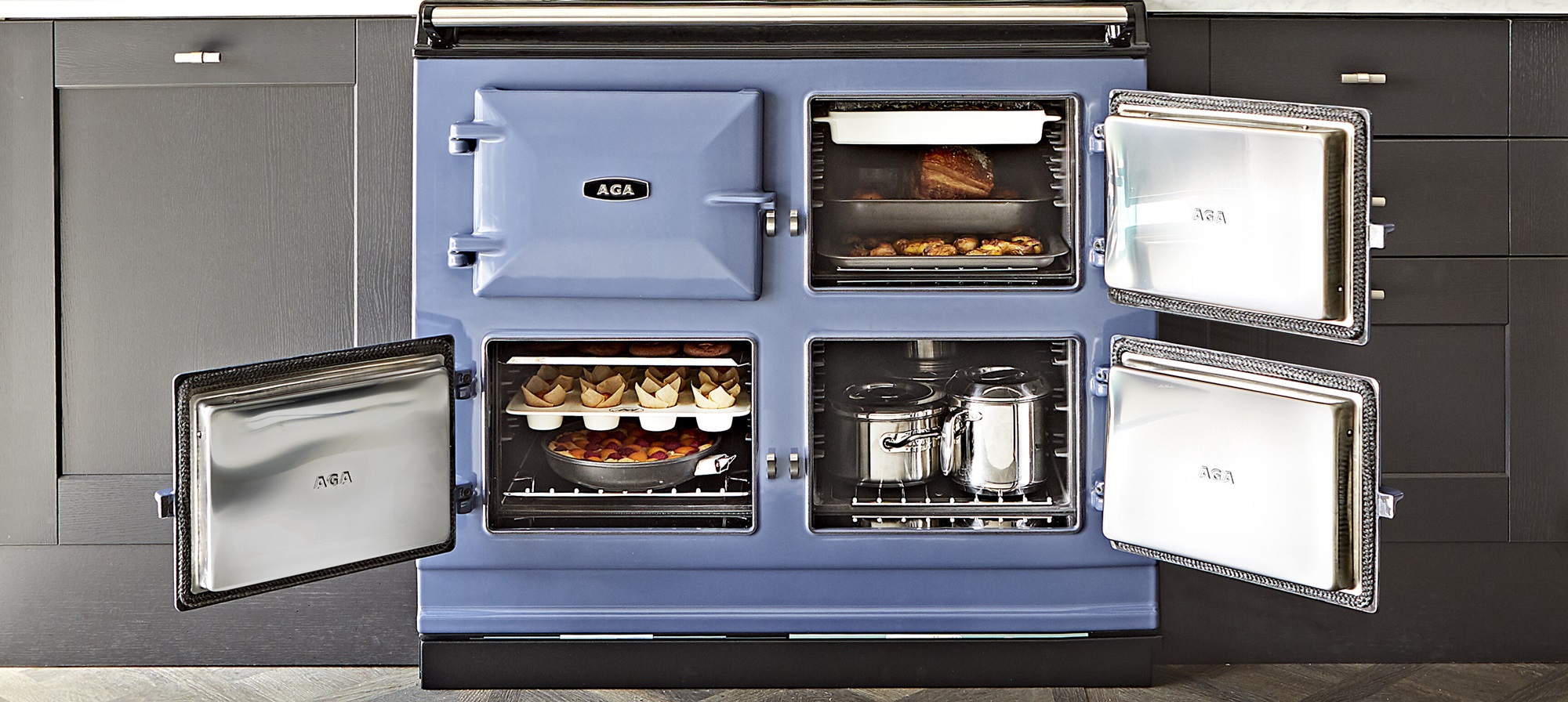 AGA eR7 100-3 in Dartmouth Blue finish with three of the four oven doors open.